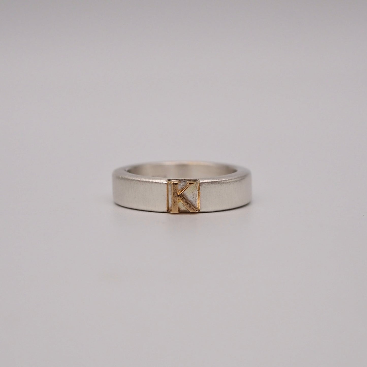 initial plain ring